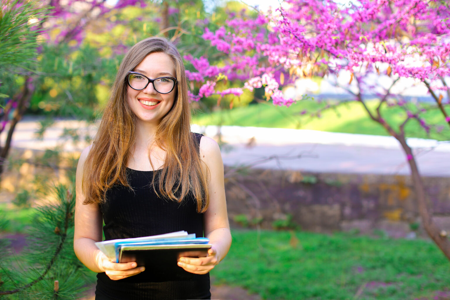 Female,Landscape,Designer,In,Glasses,Keeping,Documents,Near,Blooming,Trees