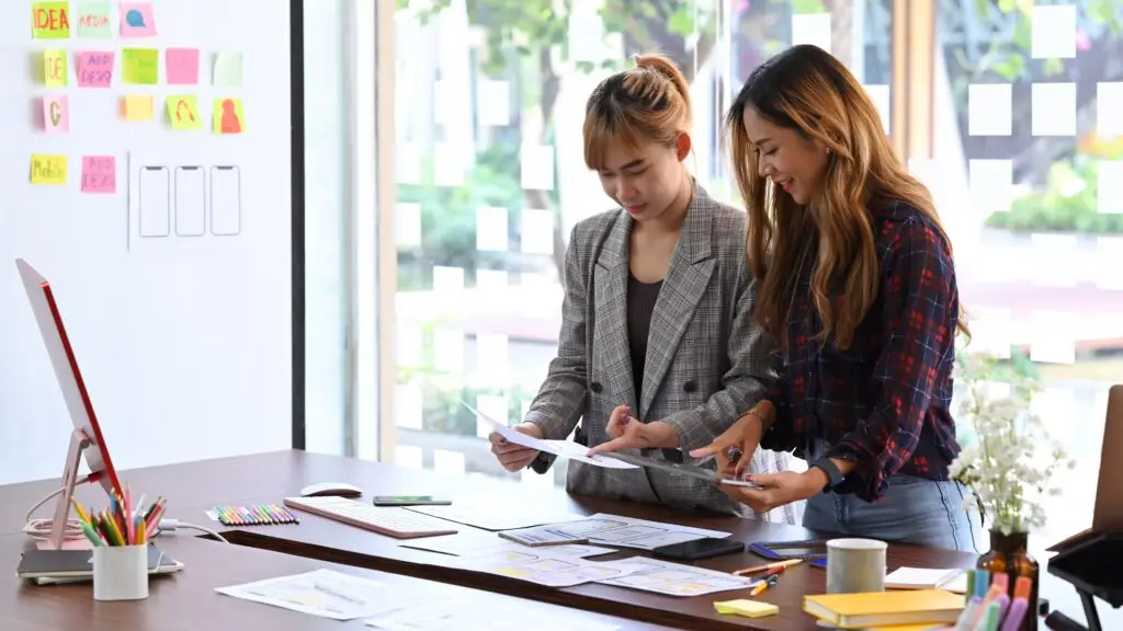 Team,Of,Ui,Designer,Discussing,About,Mobile,App,Interface,Wireframe