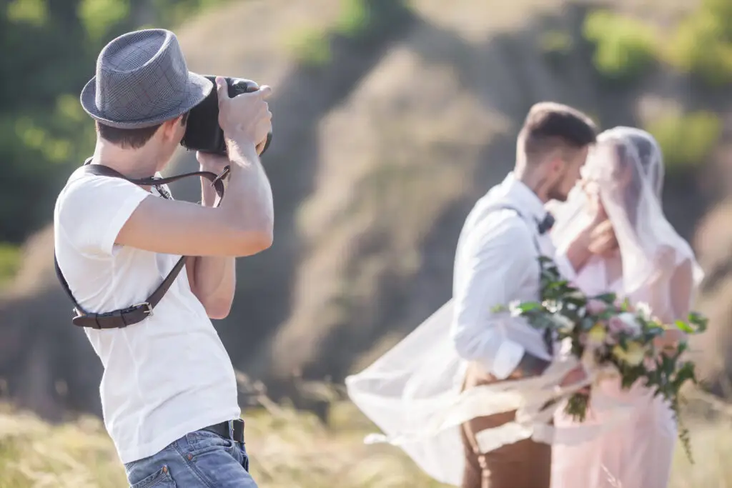 A,Wedding,Photographer,Takes,Pictures,Of,The,Bride,And,Groom