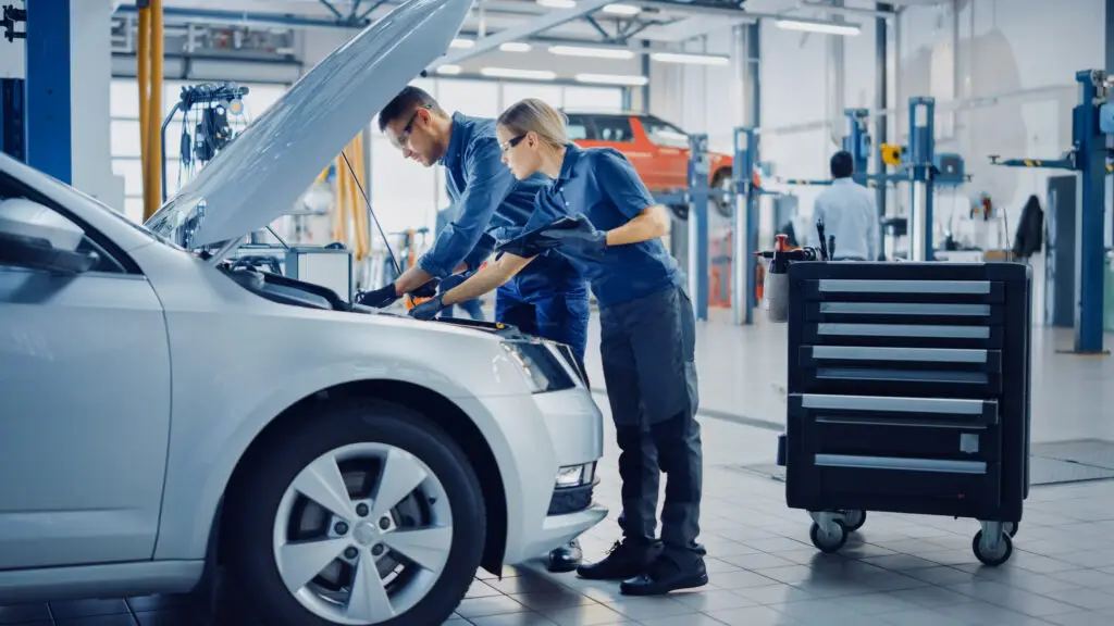 Two,Mechanics,In,A,Service,Are,Inspecting,A,Car,After